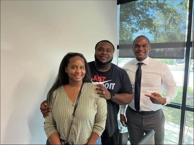 Darren Brothers with clients at closing