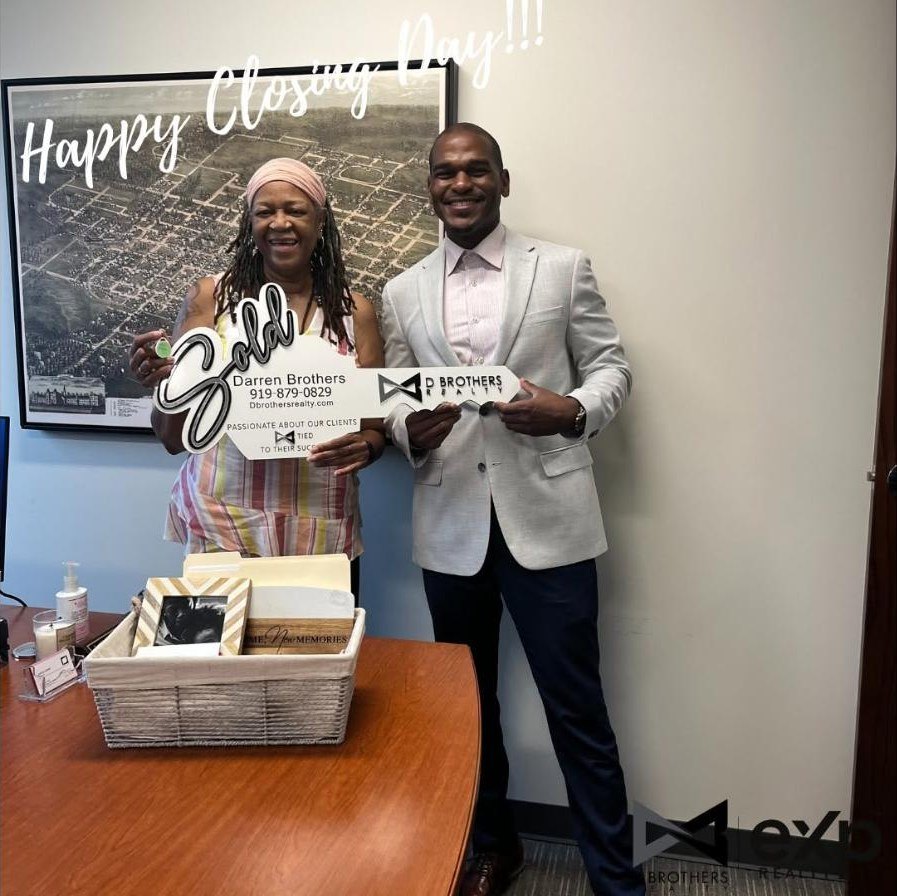 Darren Brothers with a client on closing day
