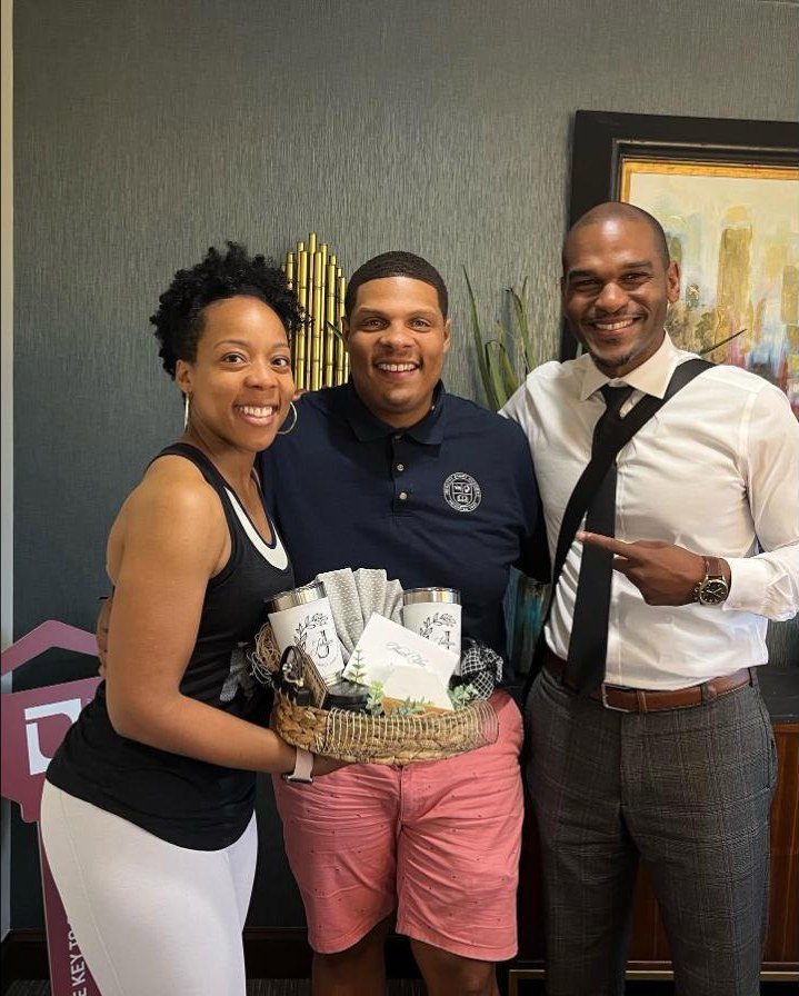 Darren Brothers with sellers at closing